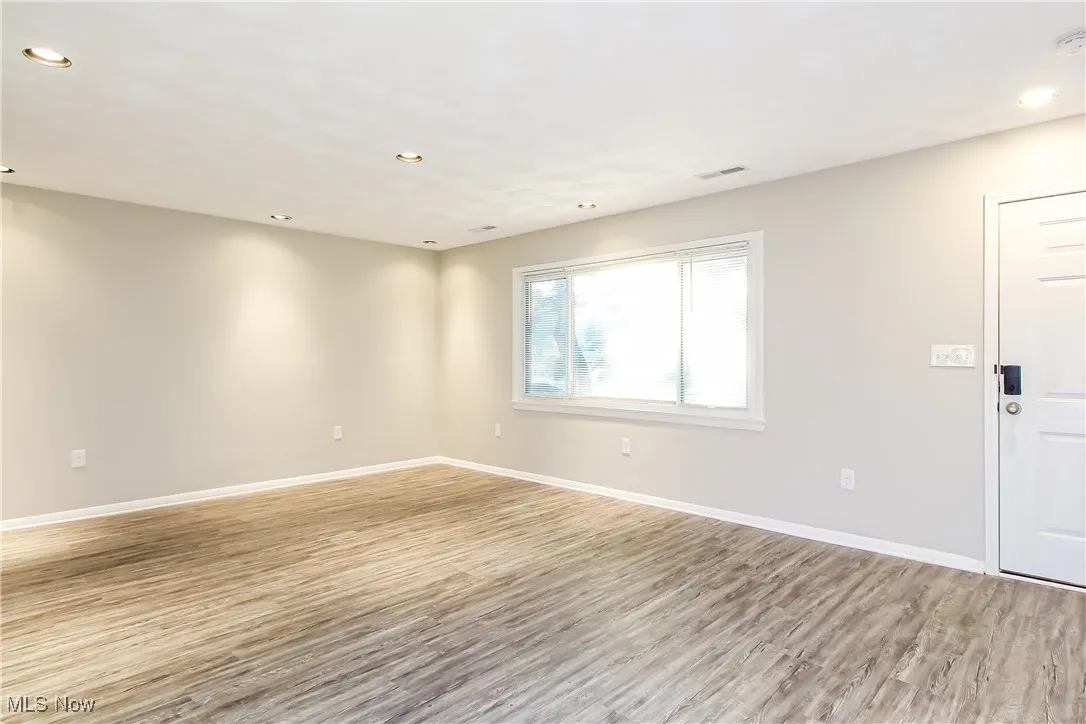 Spare room featuring light wood-style floors and recessed lighting
