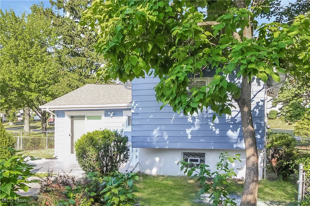 View of home's exterior featuring roof with shingles