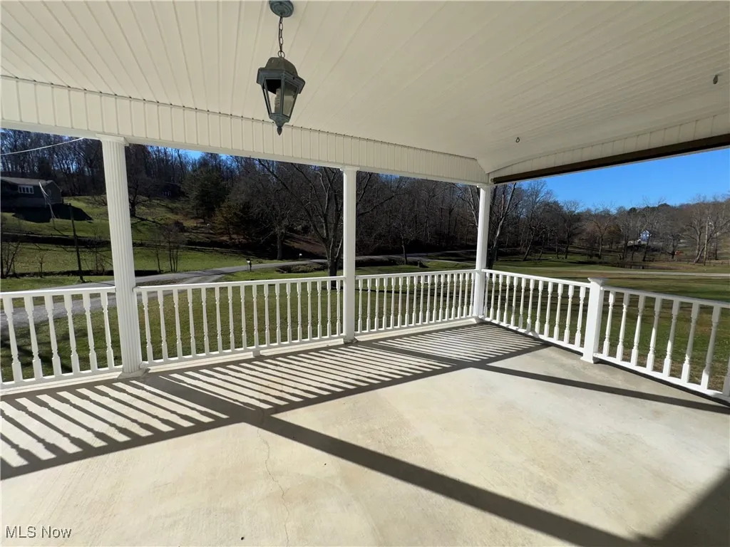 View of patio with view of wooded area