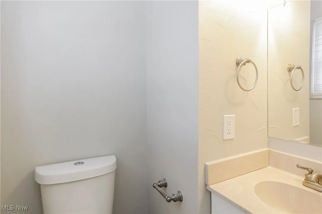 Bathroom with vanity and toilet