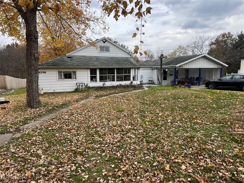 Front view of house with a shingled roof