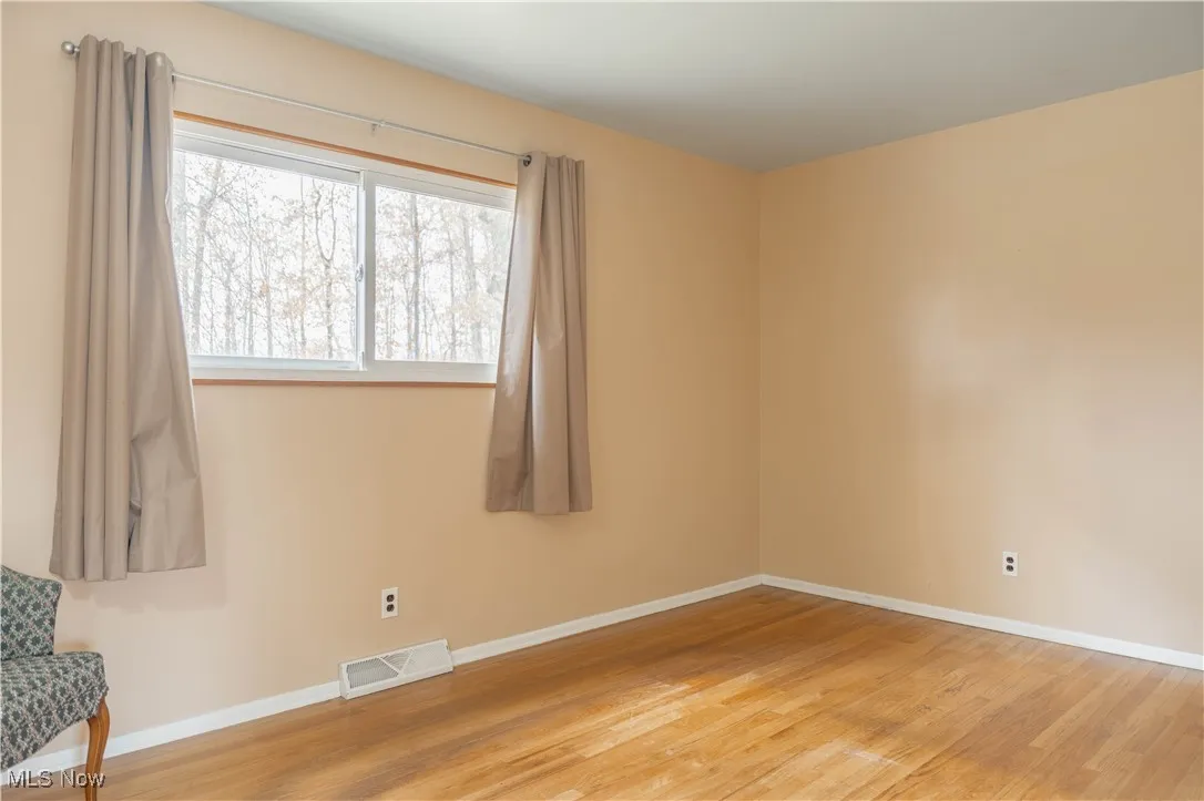 Empty room with wood finished floors
