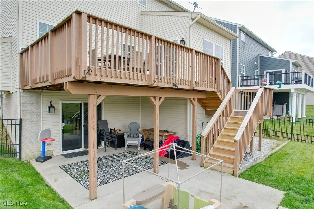 Rear view of property with a patio, stairs, and a deck
