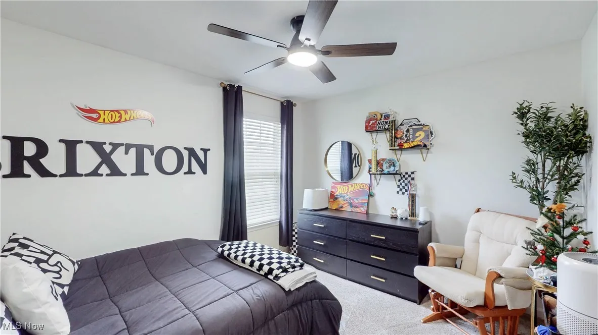 Bedroom with carpet flooring and ceiling fan