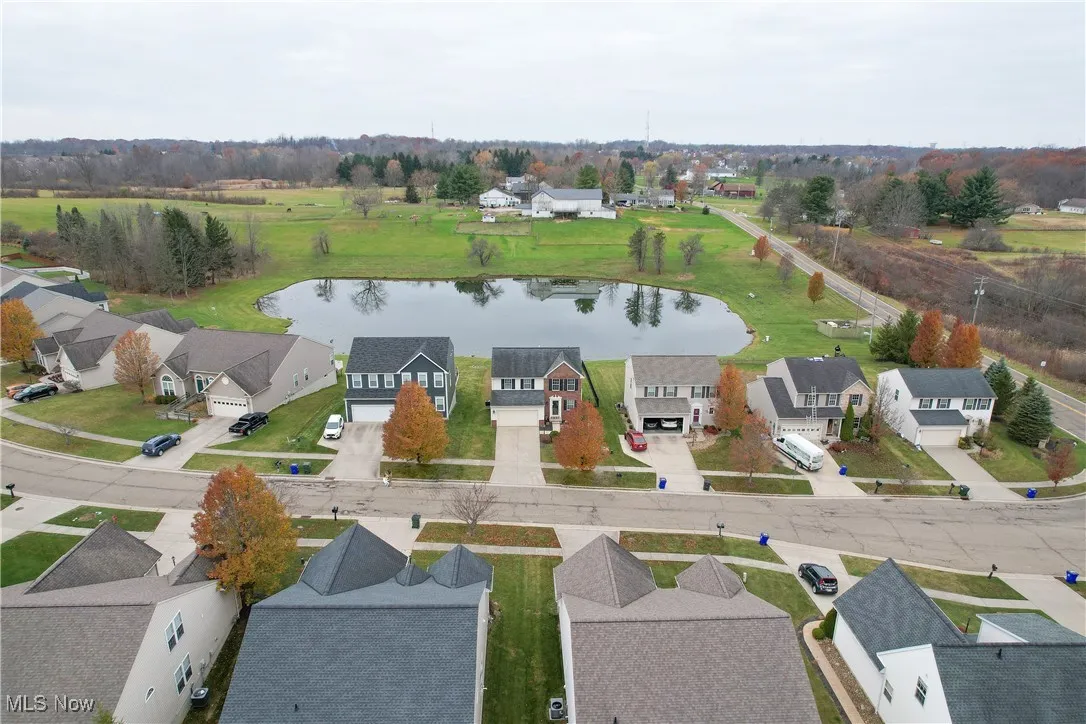 Aerial perspective of suburban area with a large body of water