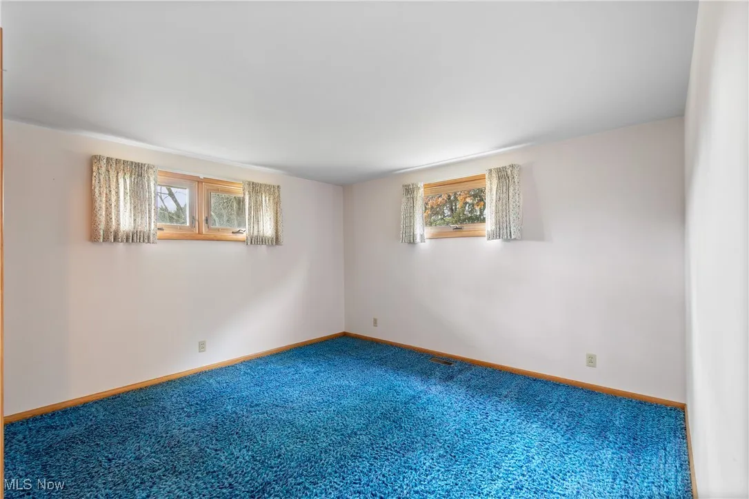 Other bedroom also has hardwood under carpeting.