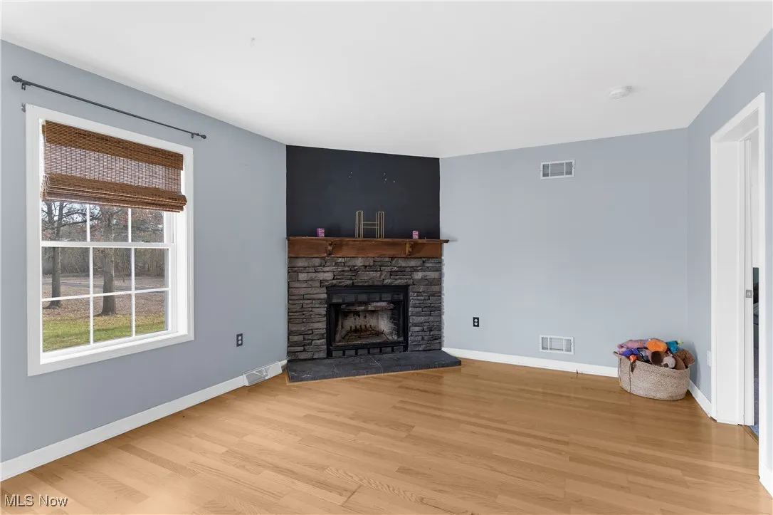 Family room at the rear of the home with fireplace