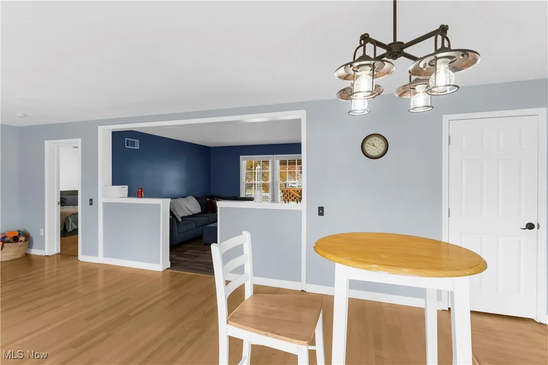 Dining area. Family room w fireplace to your left. Living room seen in front of you.  Master bed far left door opening