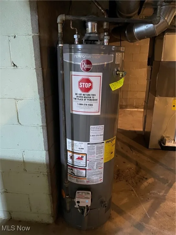 Utility room with water heater and heating unit
