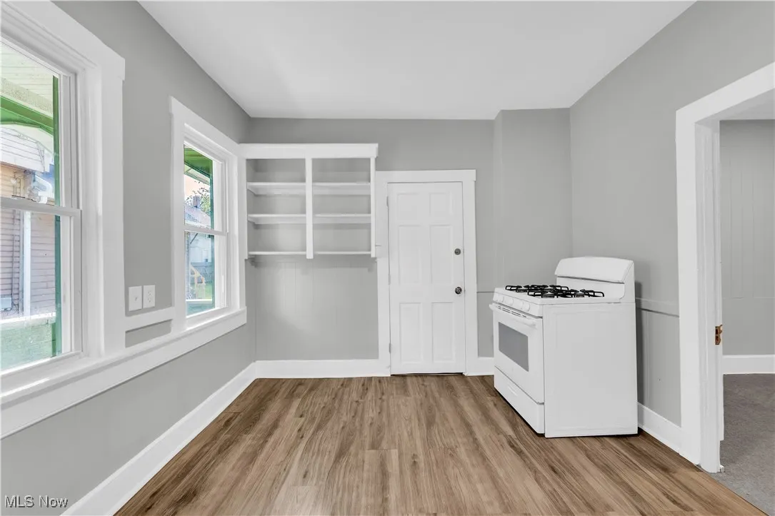 Kitchen featuring gas range gas stove and light wood-style flooring