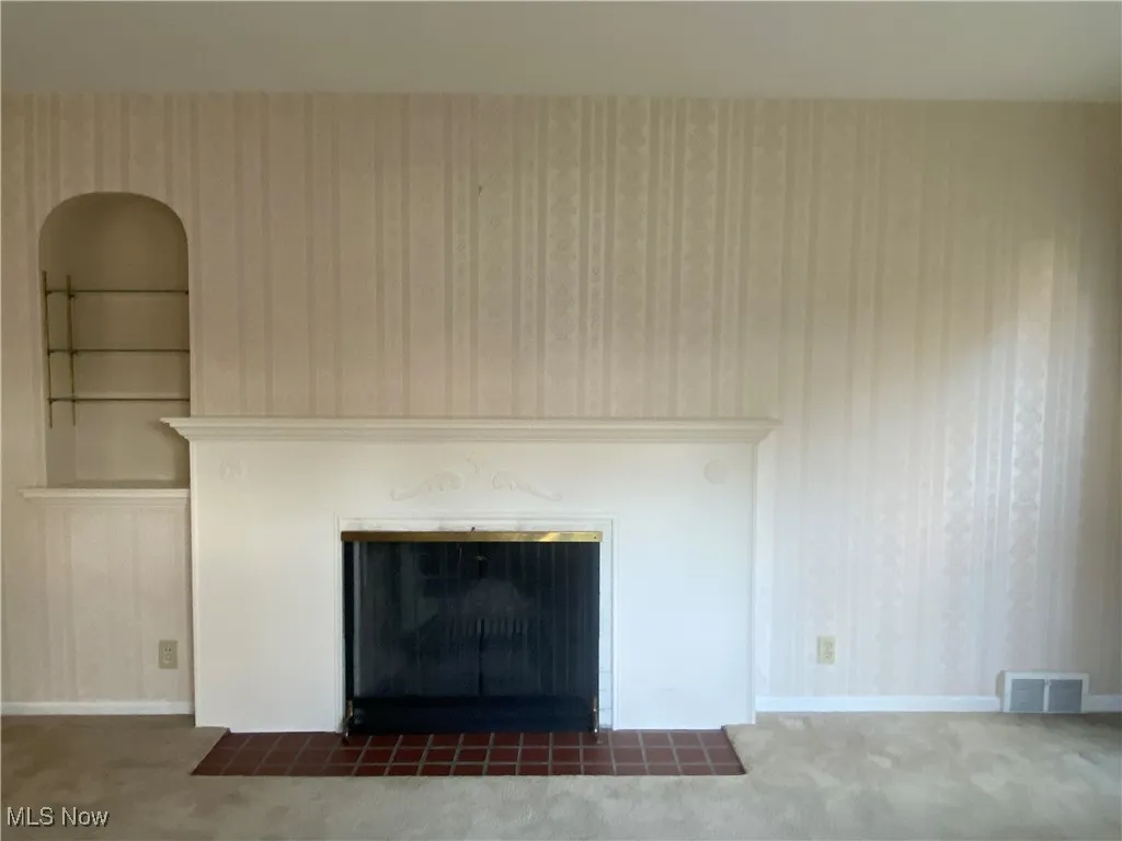 Wood burning fireplace in front room