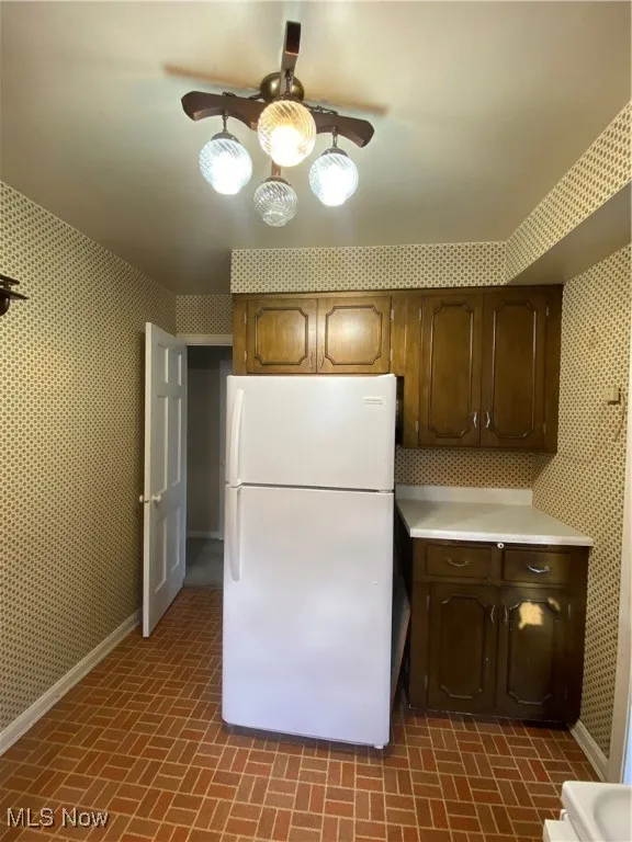 Kitchen with refrigerator