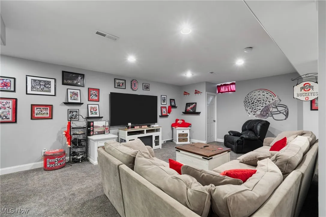 Living room featuring carpet floors and baseboards