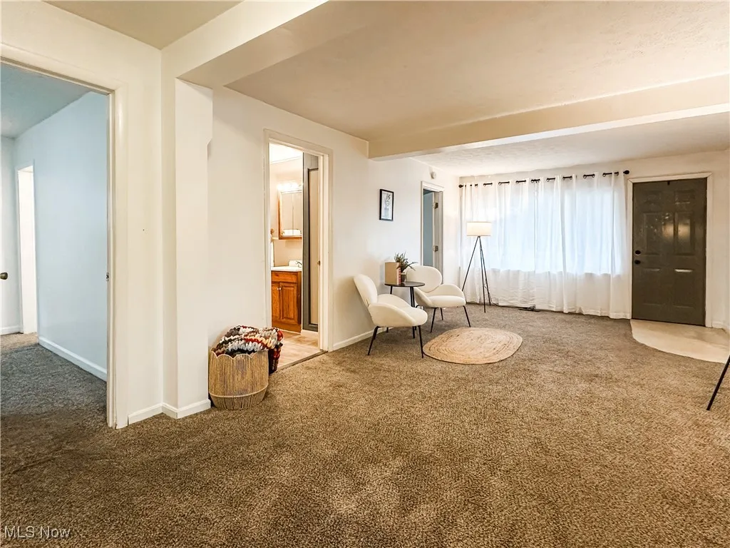 from living room into main level bath and primary bedroom ...