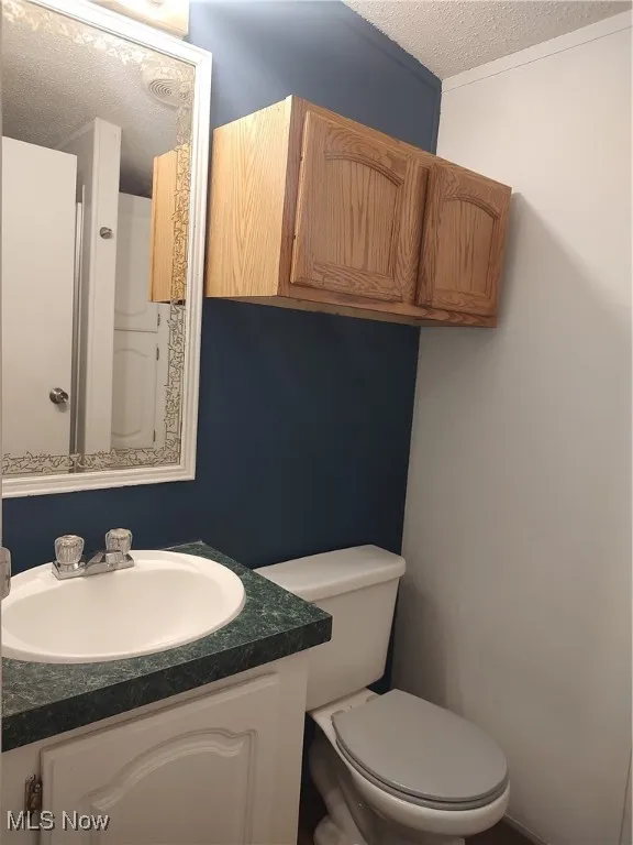 Main Bathroom with shower and linen storage.