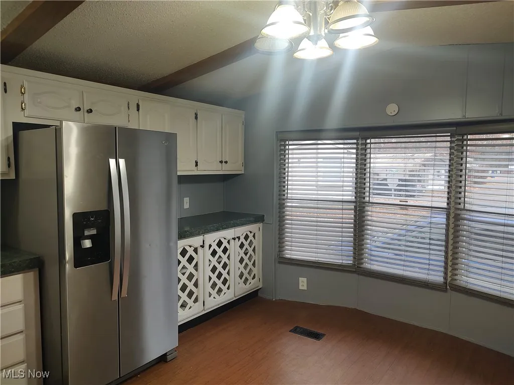 Kitchen includes plenty of storage and cozy eating area.