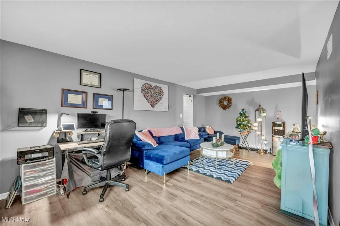 Home office with light wood-style floors
