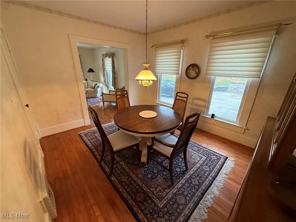 Dining space with light wood-style floors
