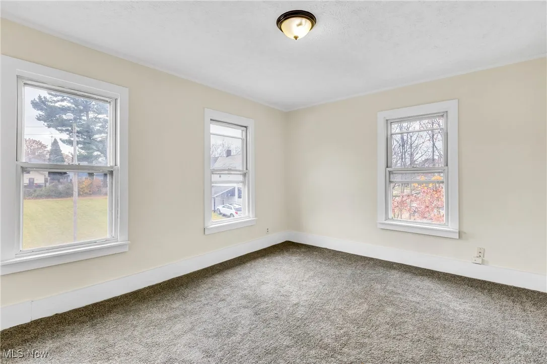 Empty room with carpet floors