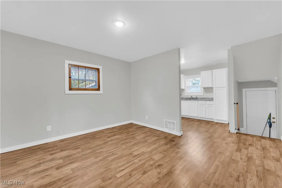 Unfurnished room with light wood finished floors