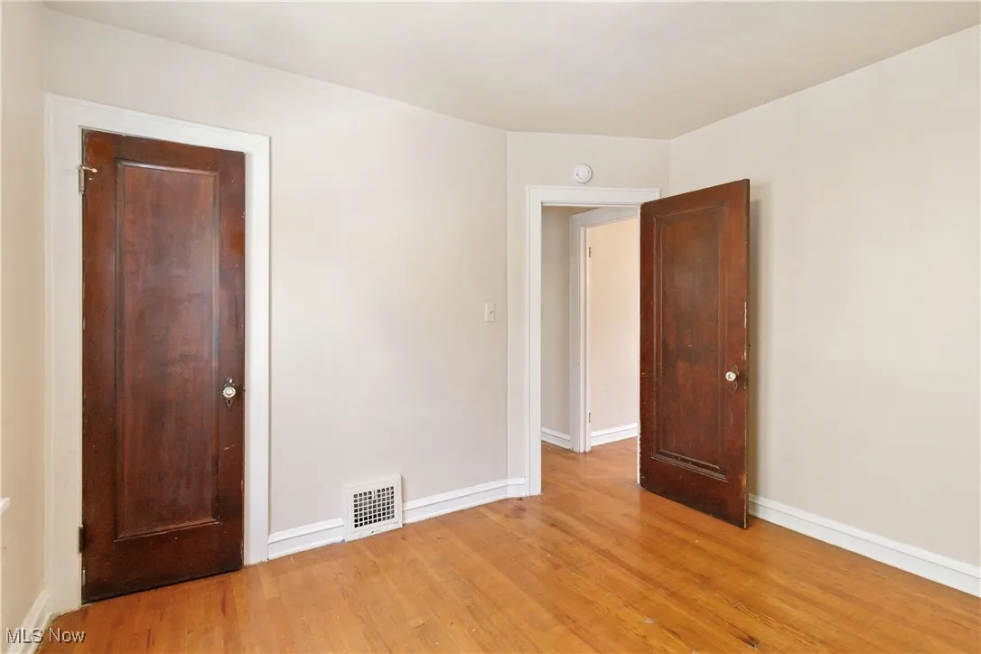 1st Floor bedroom featuring baseboards and light wood finished floors