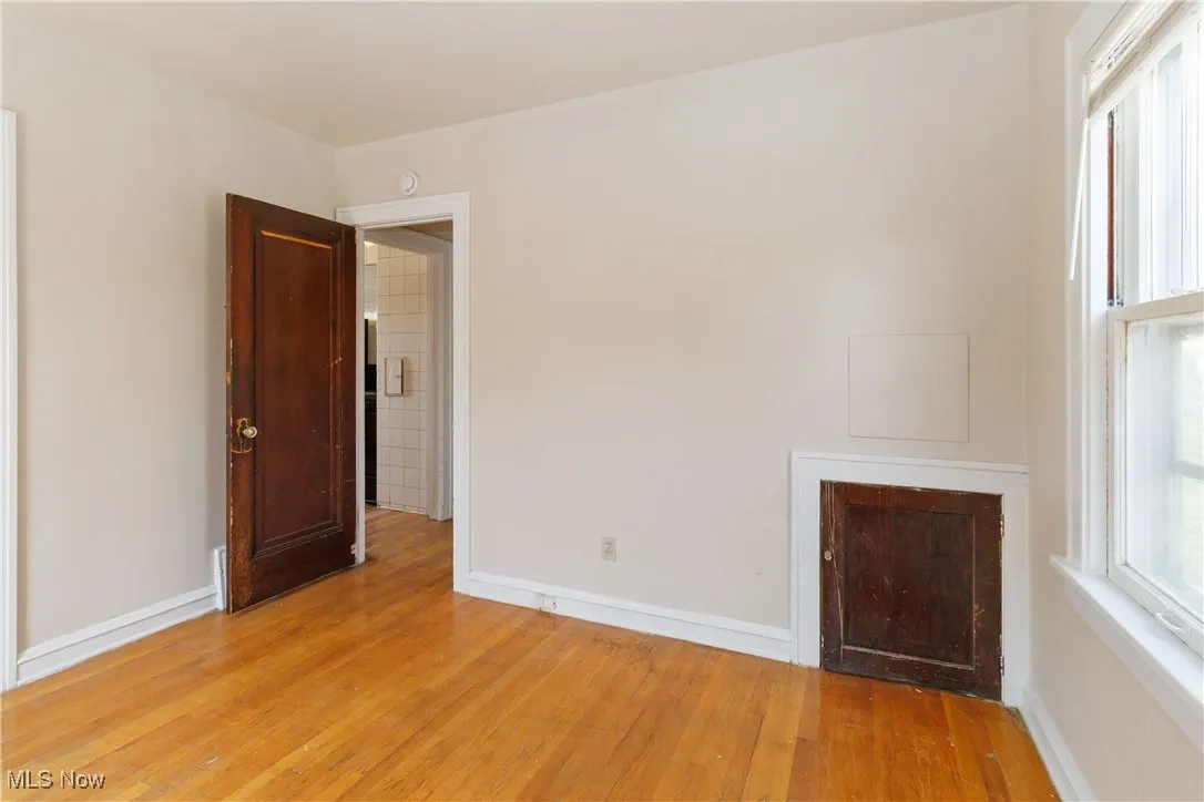 1st Floor living room featuring wood-type flooring and baseboards