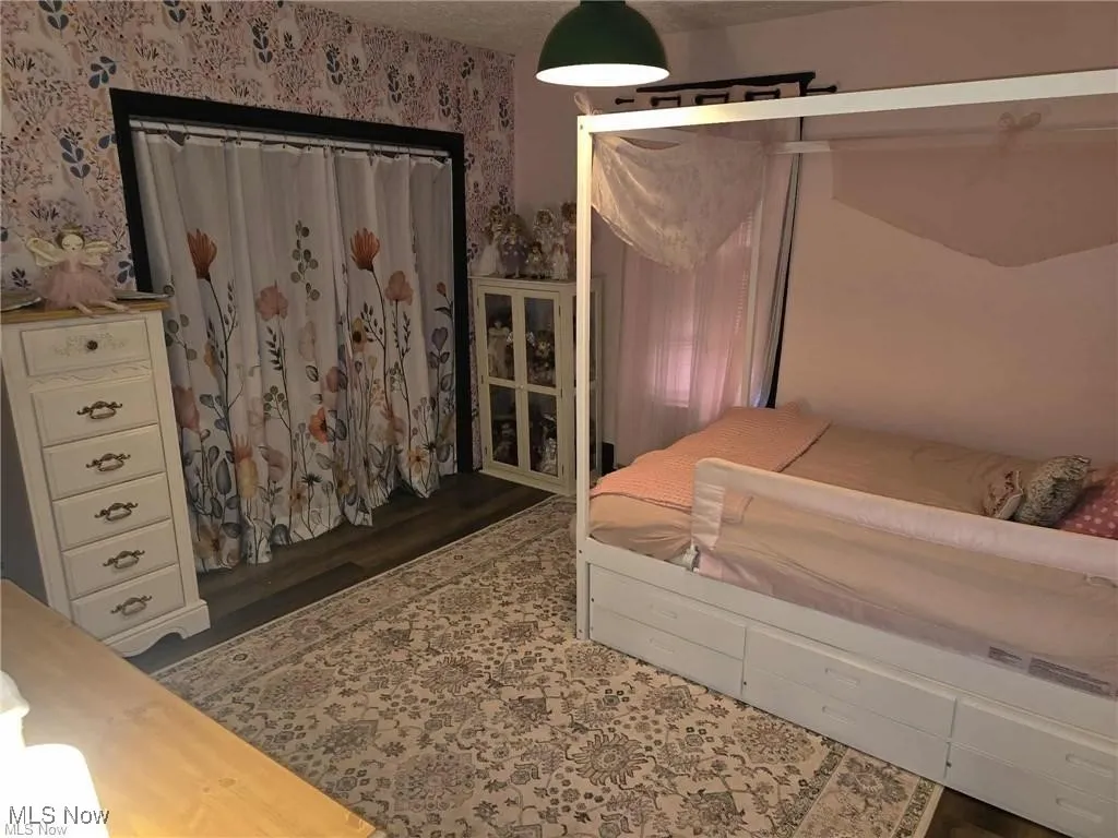 Bedroom featuring wood finished floors