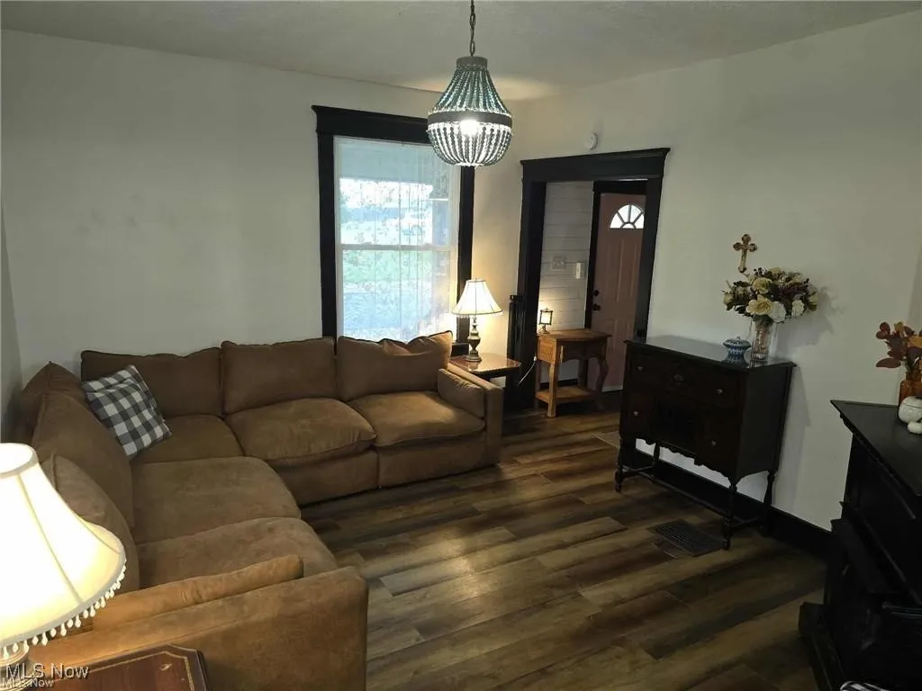 Living area featuring dark wood finished floors