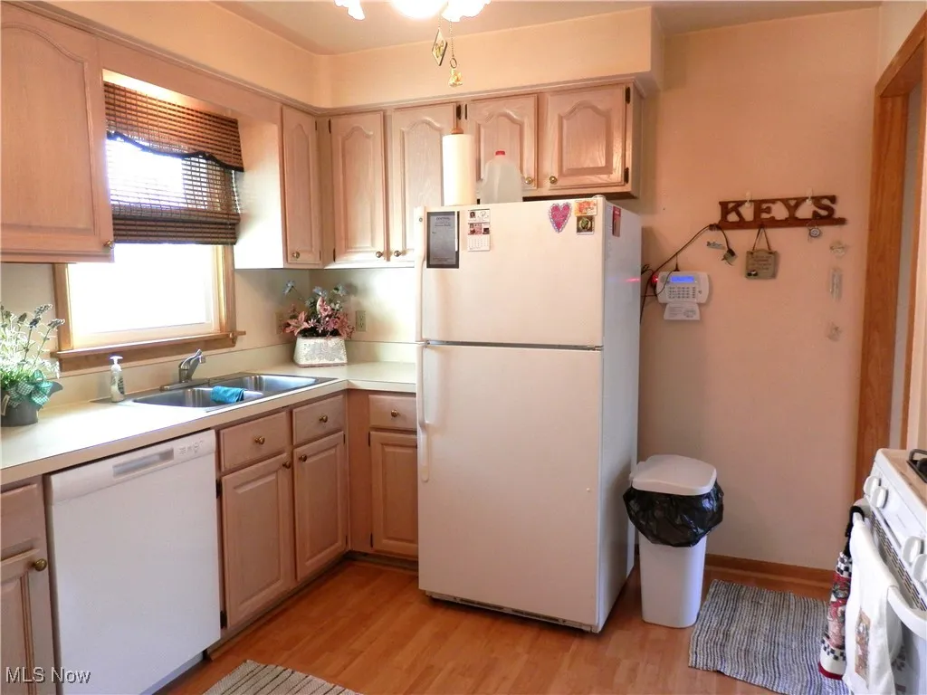 Kitchen featuring white appliances
