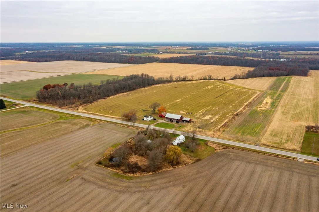 Aerial view of property and surrounding area with rural landscape and farmland
