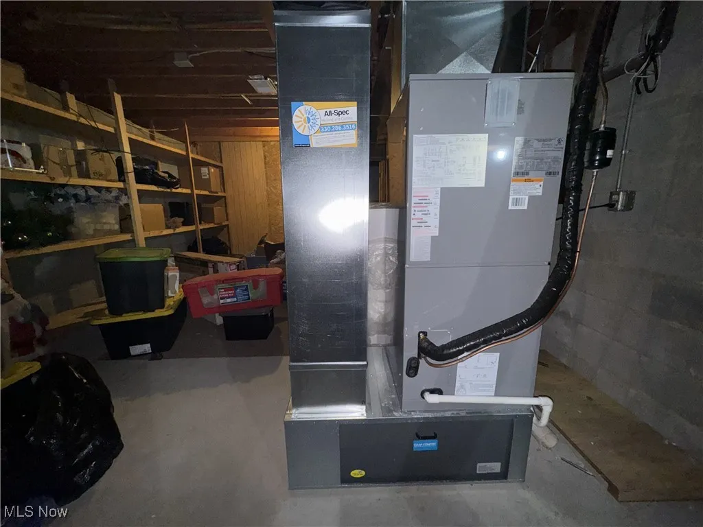 Utility room featuring heating unit