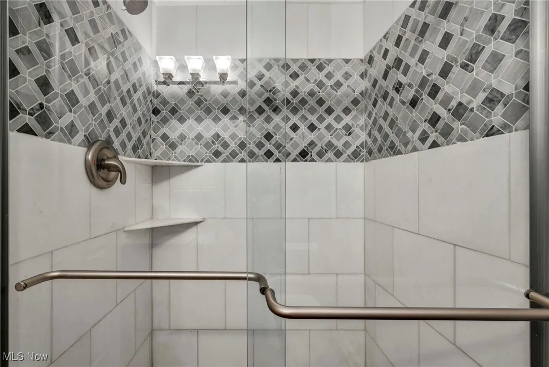 Full bath with tiled shower