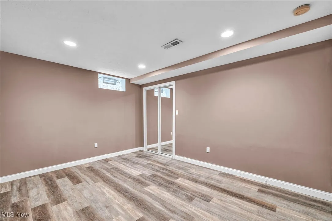 Basement featuring recessed lighting and wood finished floors