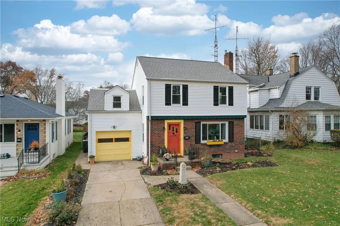 View of front of house featuring brick siding, a garage, concrete driveway, and a shingled roof