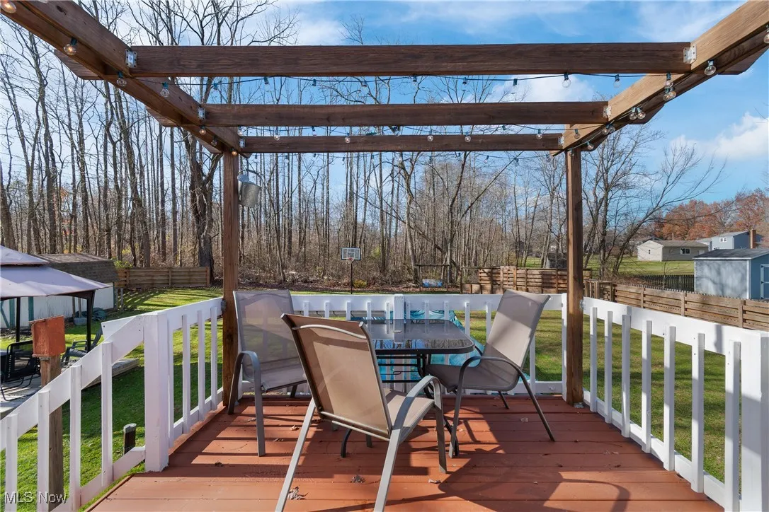 Wood deck with dining space overlooking the backyard