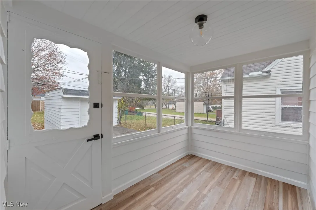 Unfurnished sunroom with healthy amount of natural light