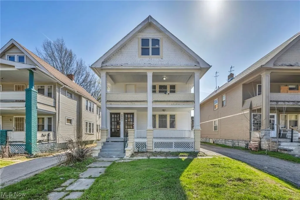 View of front of house featuring a front yard and a porch
