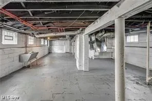 Basement featuring a sink