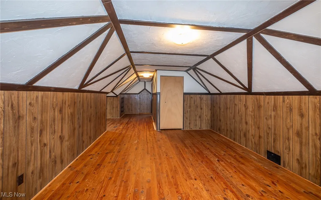 In closet, there's a door that leads to another storage area w. light.