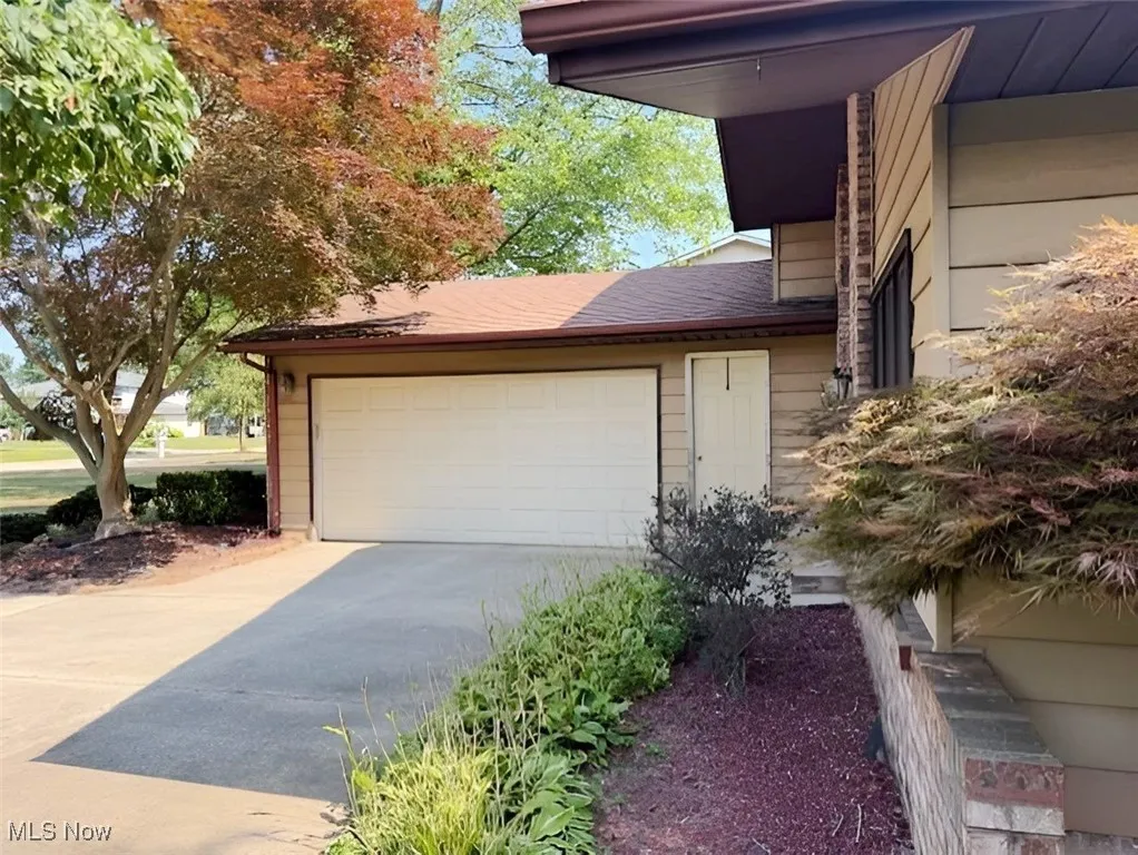 Garage featuring driveway