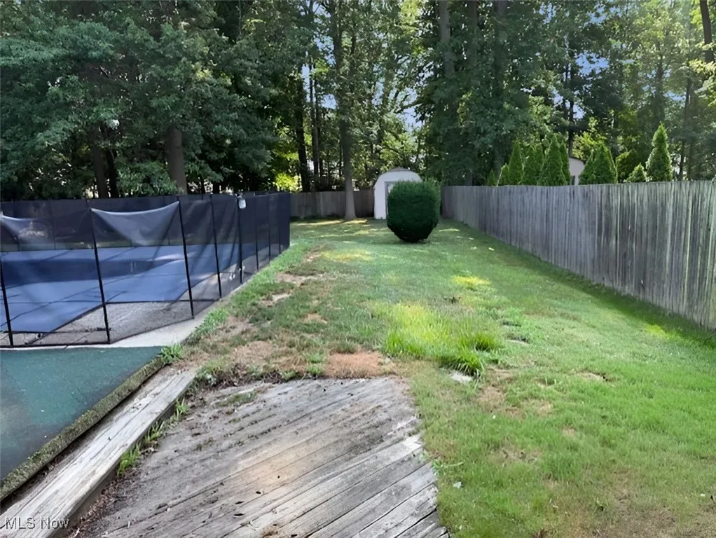 View of fenced backyard