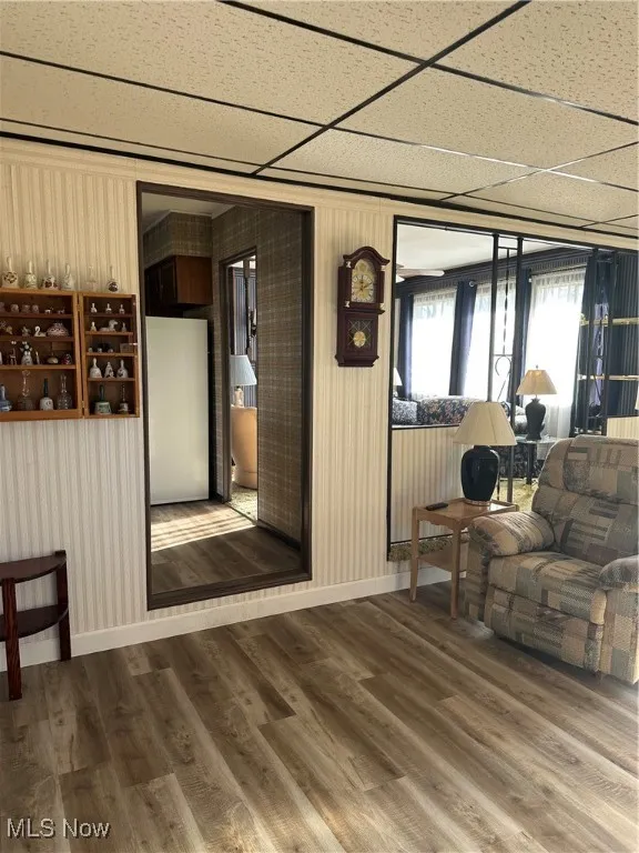 Living Room with new Luxury Vinyl Floors, lots of natural lighting just off the kitchen and Family room