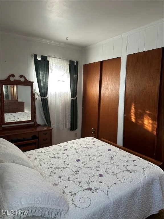 Bedroom with multiple closets