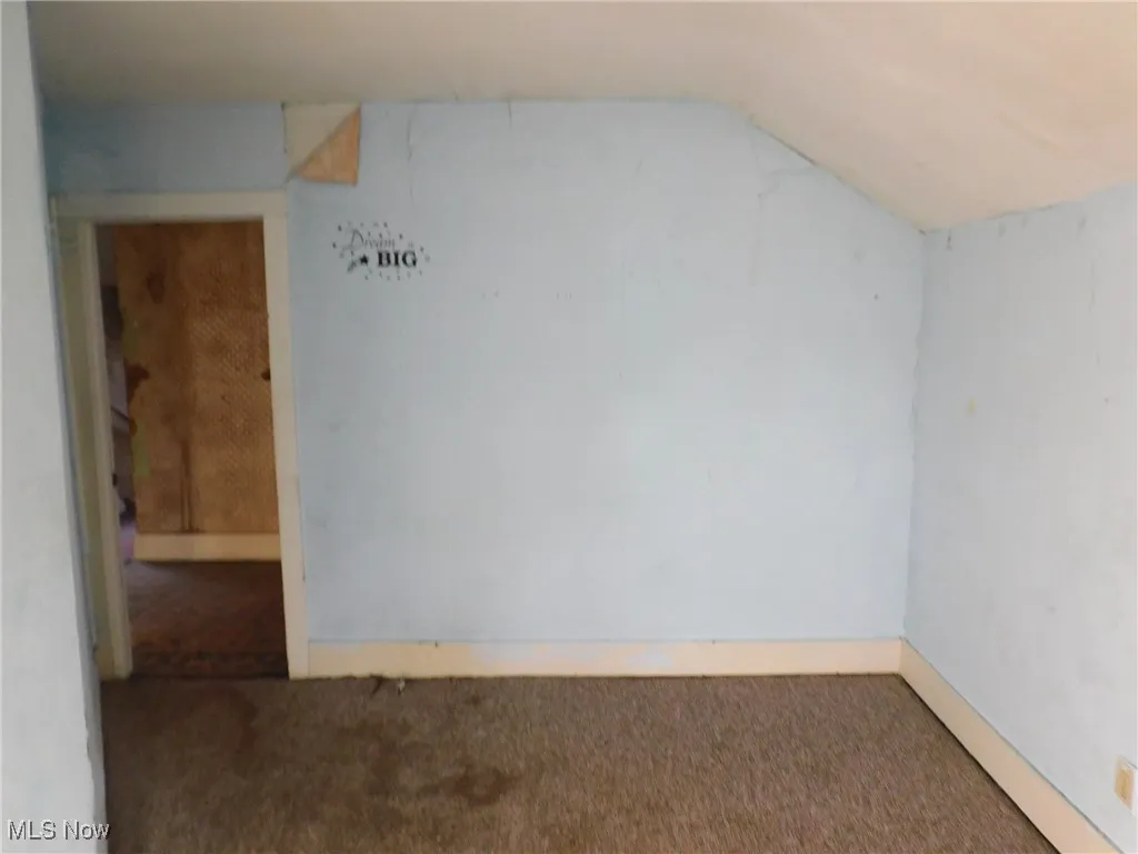 bedroom 3 up B  with carpet floors and lofted ceiling
