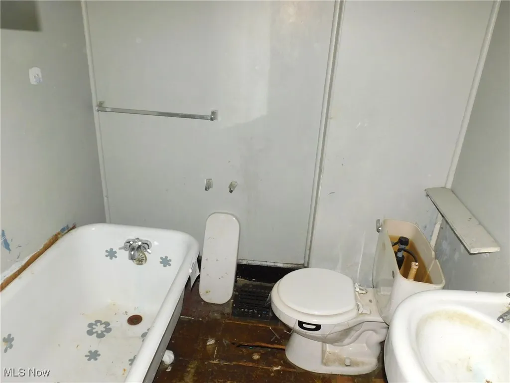 Full bath 2nd floor with a soaking tub and a sink