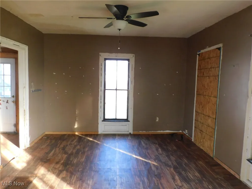 dining room  A with wood finished floors, plenty of natural light, and a ceiling fan
