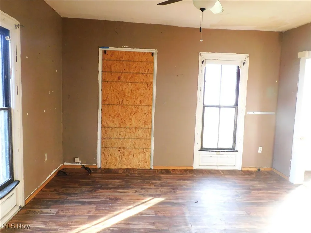 dining room view B room with wood finished floors and ceiling fan