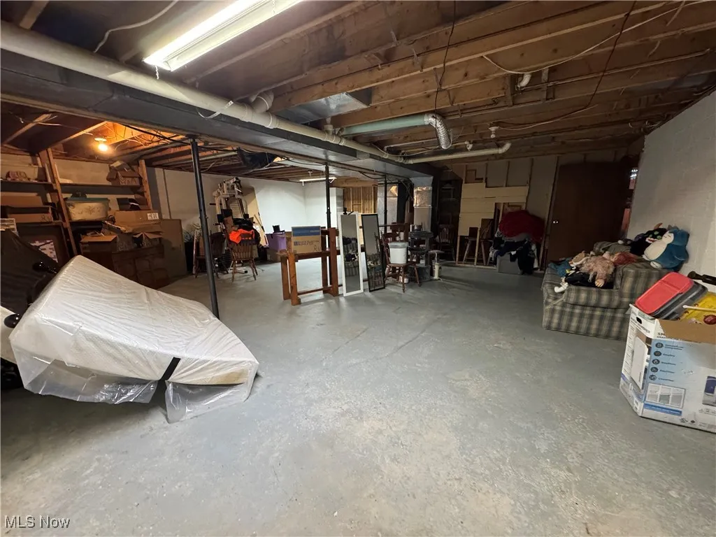 Storage room with walk up stairs to outside