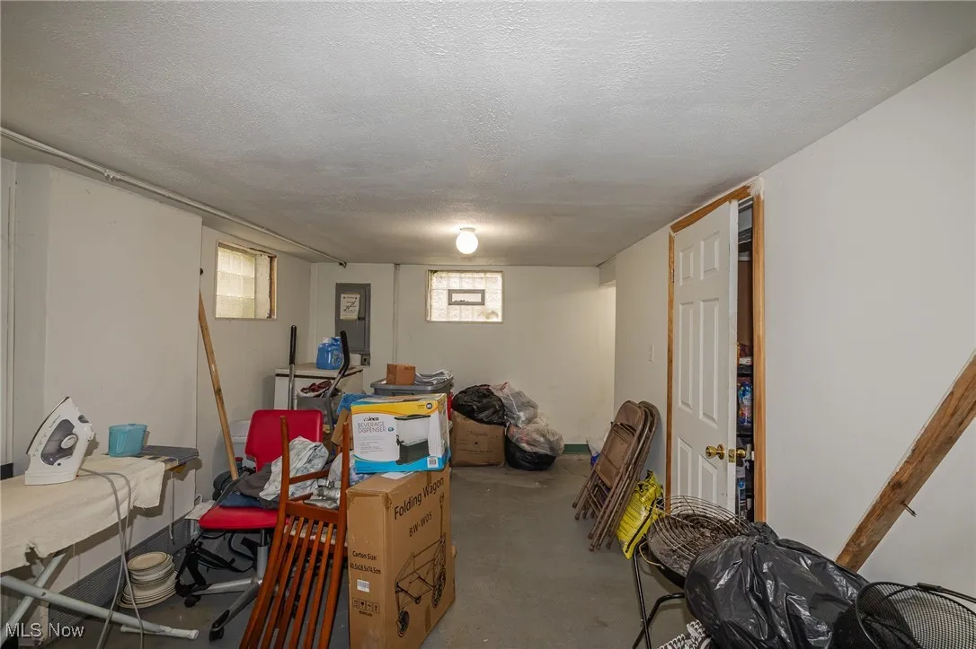 Below grade area featuring a textured ceiling