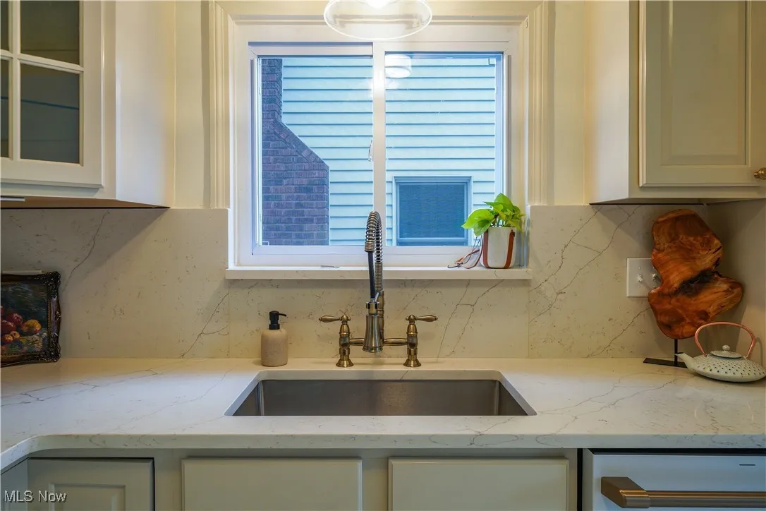 Beautiful quartz countertops, new farmhouse sink and new faucet.